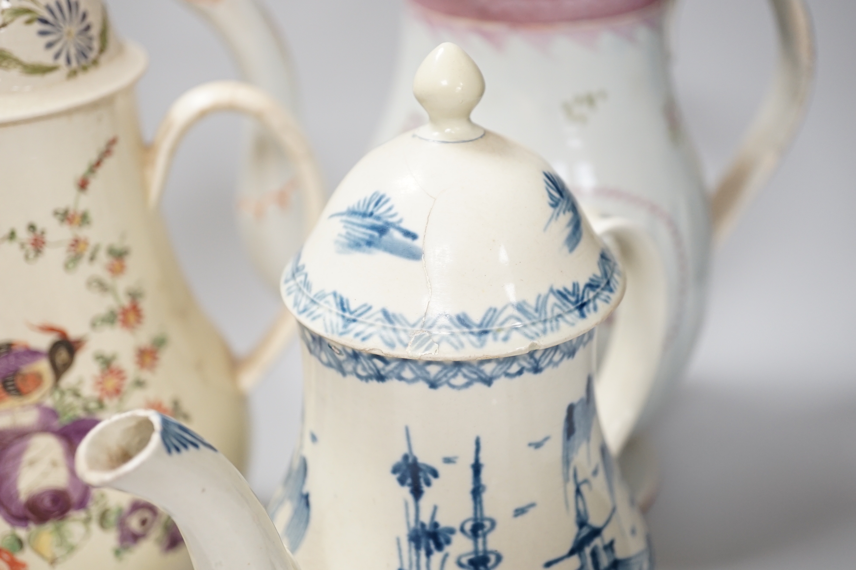 Three Georgian creamware and pearlware teapots, a jug and a mug, tallest 27cm